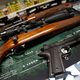 A Remington 700 hunting rifle, a Remington 1100 shotgun and a Remington R1 Enhanced model 1911 pistol are seen for sale at Atlantic Outdoors gun shop on March 26, 2018 in Stokesdale, North Carolina